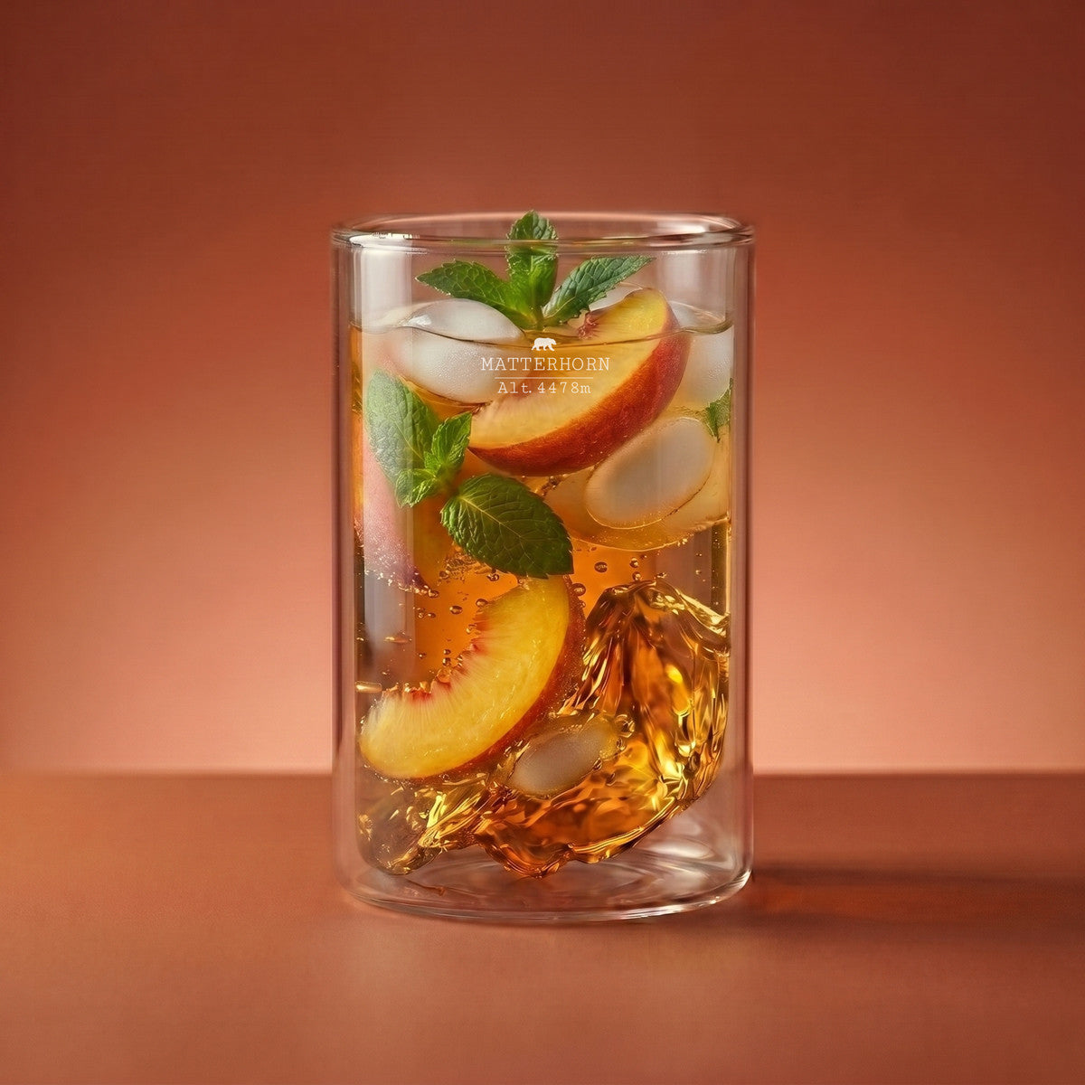 Matterhorn double wall glass — a long peach cocktail