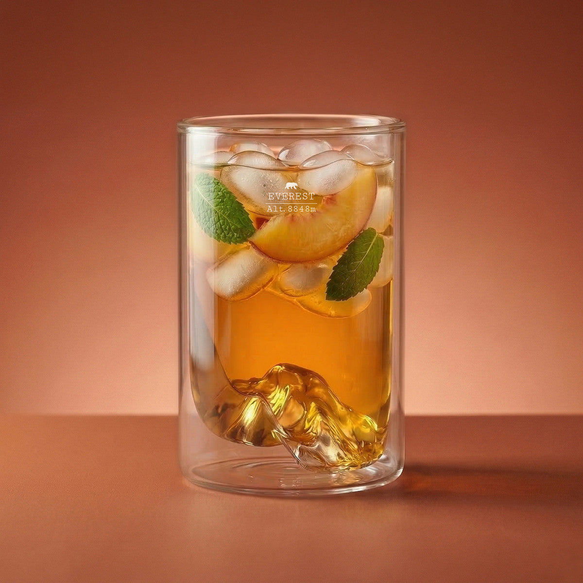 Mt. Everest double wall glass — an iced peach cocktail