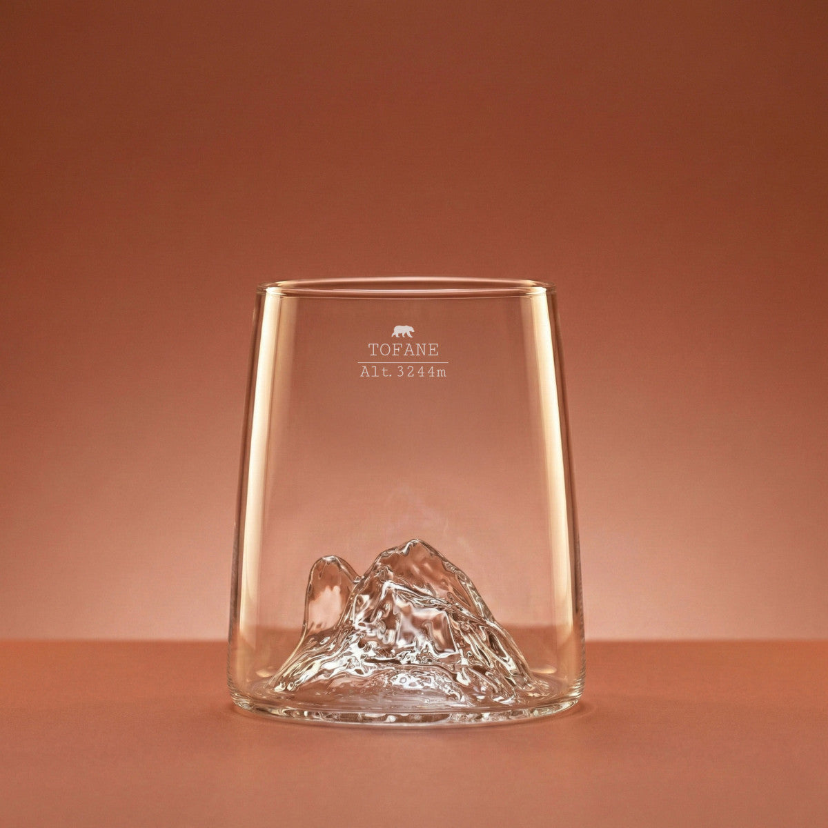 Tofane shooter glass on a warm backdrop