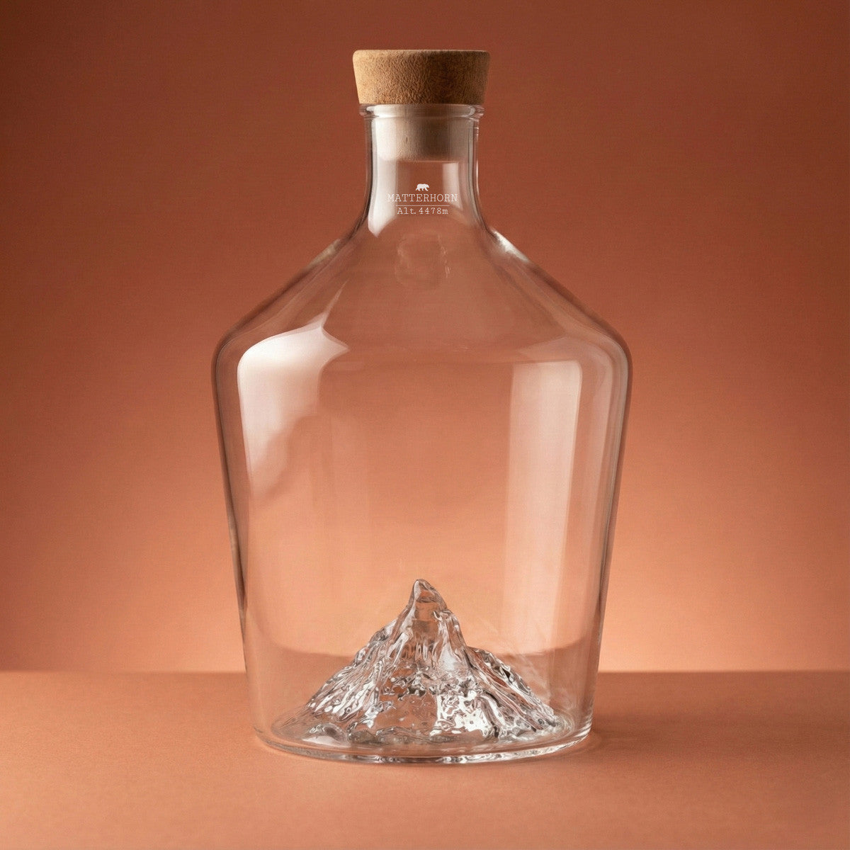 Matterhorn spirit decanter, empty, on a warm backdrop
