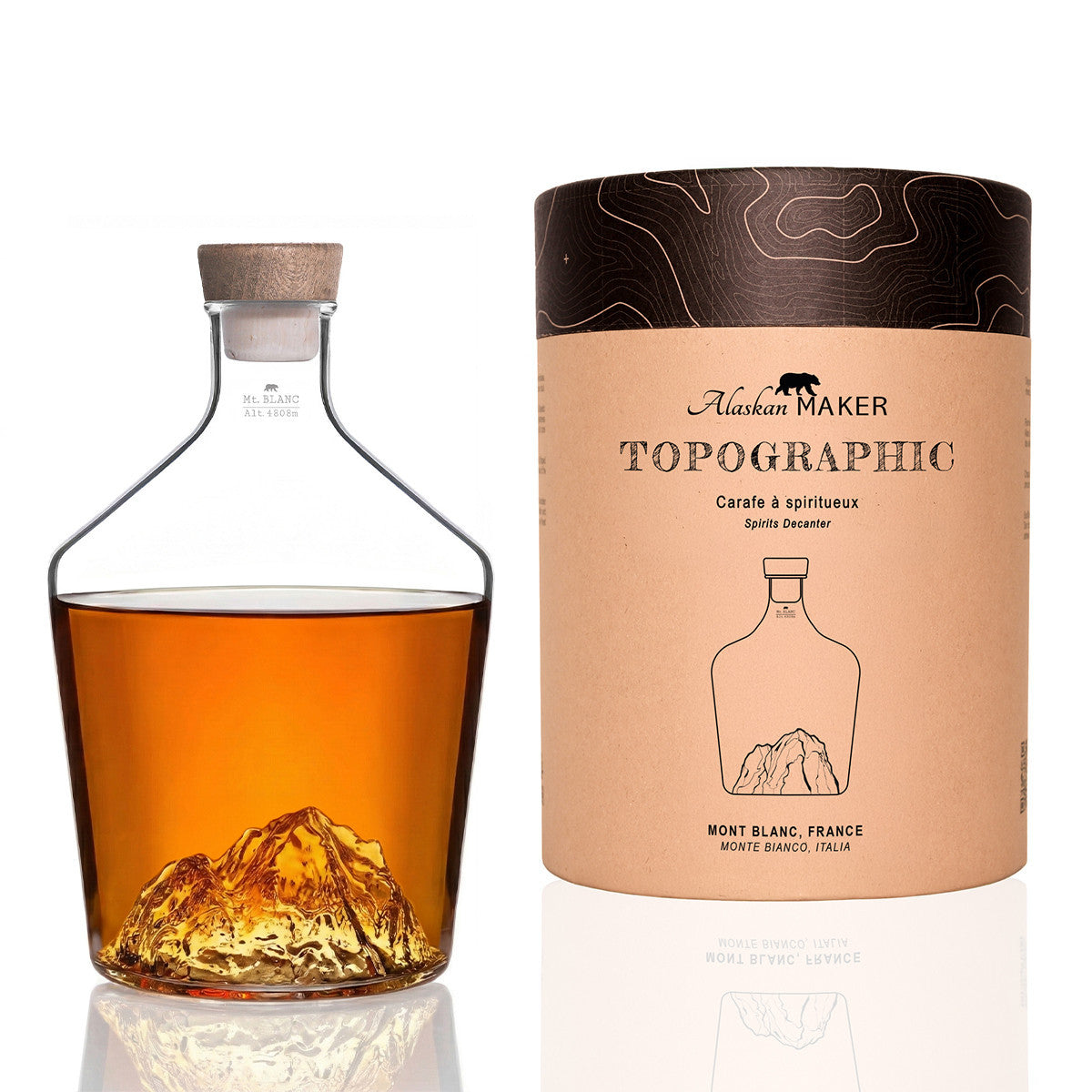 Mont Blanc spirit decanter filled with whisky, beside its gift tube