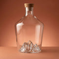 Mt. Everest spirit decanter, empty, on a warm backdrop