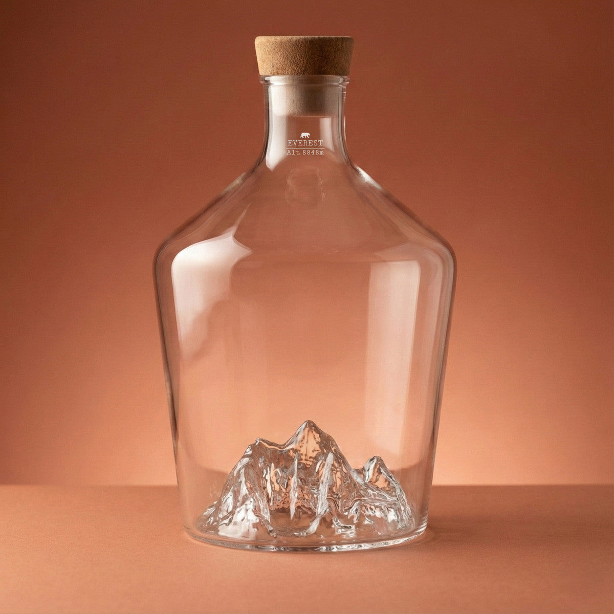 Mt. Everest spirit decanter, empty, on a warm backdrop